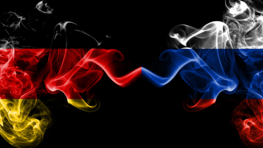 Germany vs Russia, Russian smoky mystic flags placed side by side. Thick colored silky smoke flags of Deutschland and Russia, Russian.