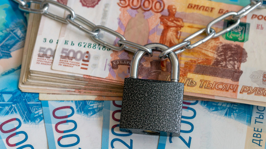 The money and lock. Bundle of five thousand bank notes, preservation of capital, Russian money closeup