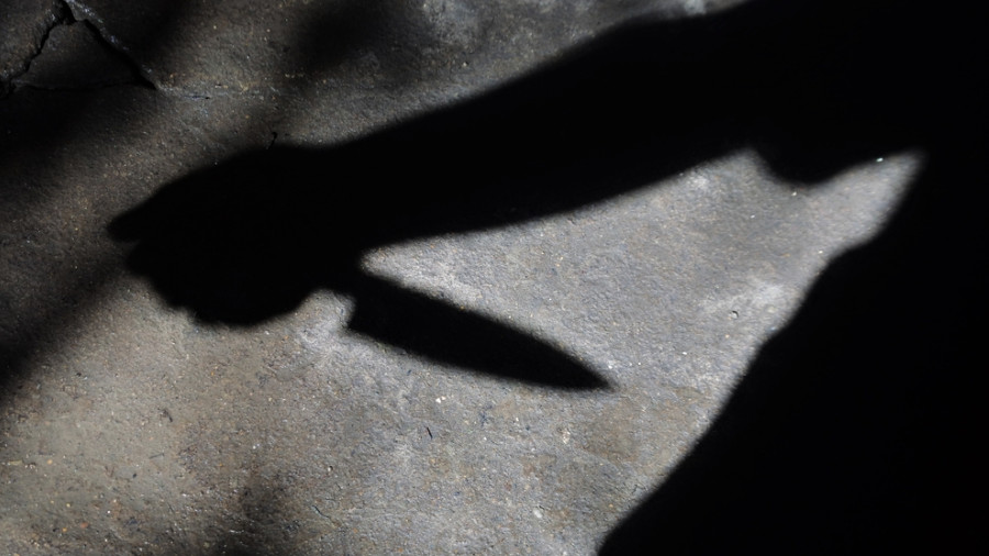 Silhouette of sad male holding knife. concept of killing